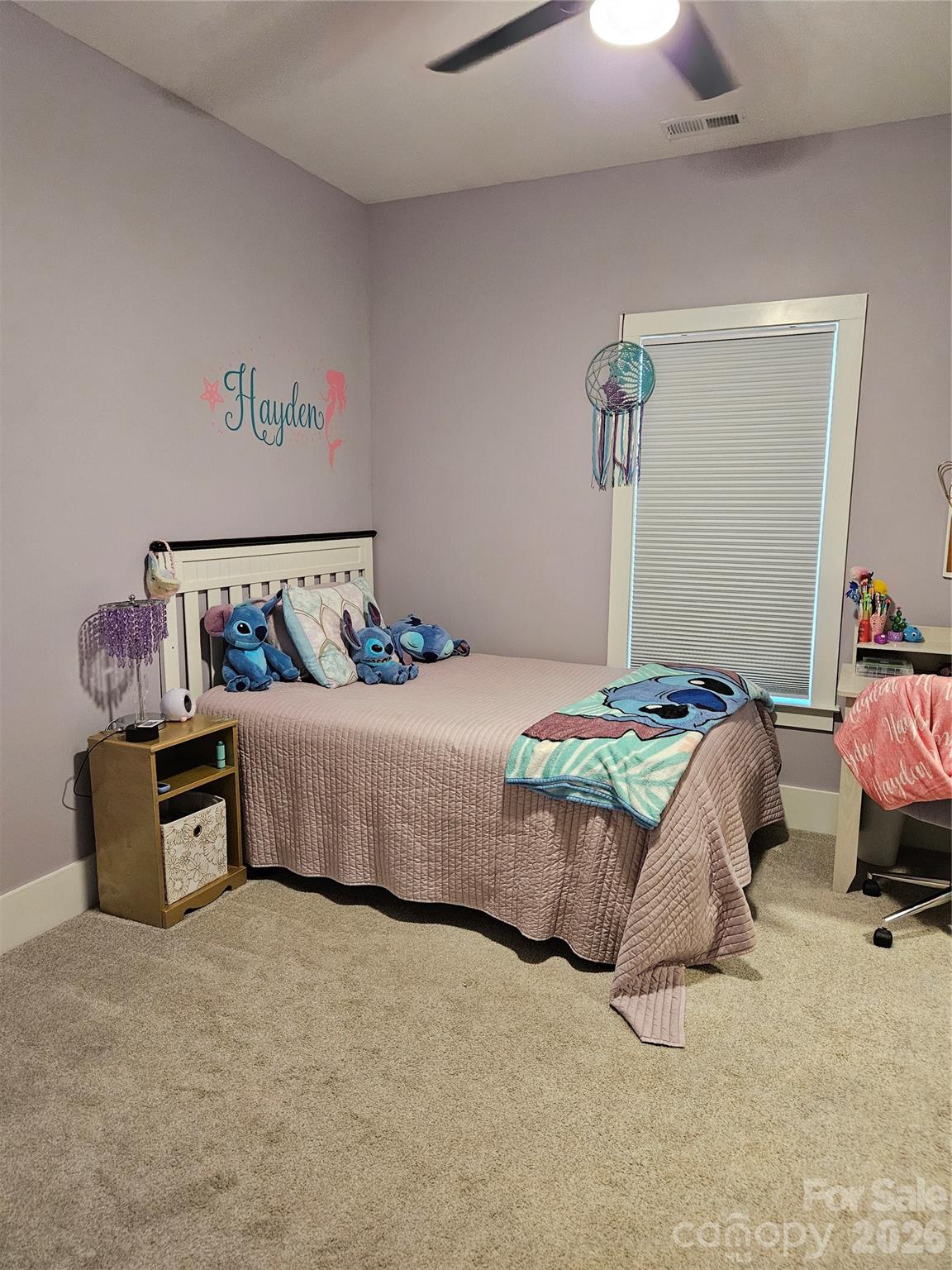 6512 Medlin Road Monroe, NC 28112 - Photo 17 of 28 a bedroom with a bed and a couch