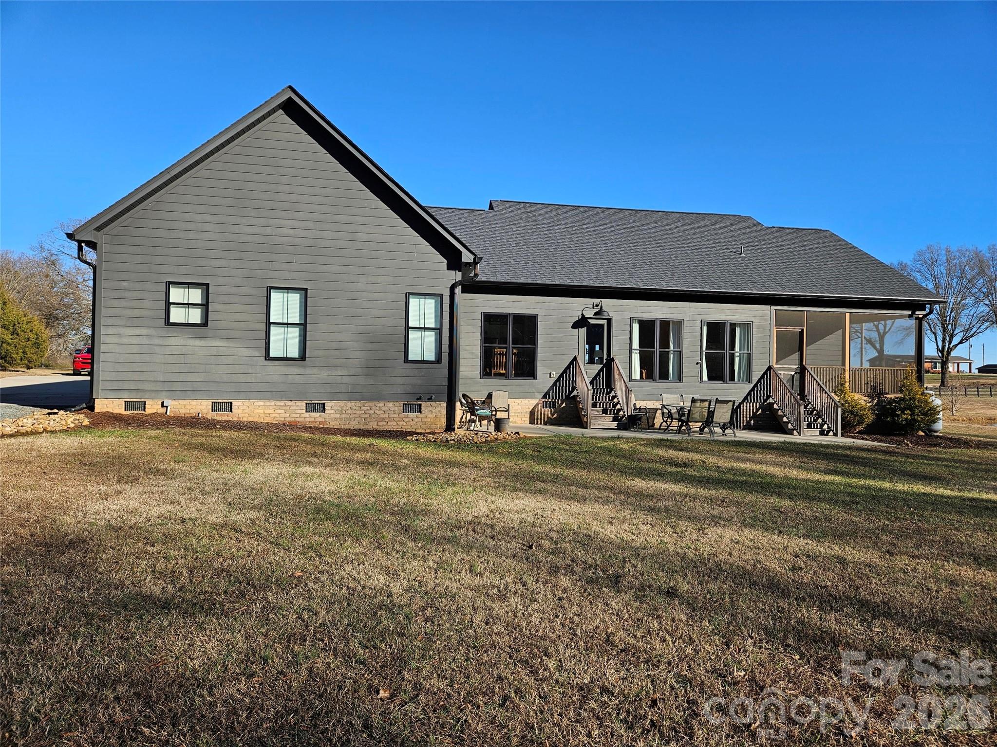 6512 Medlin Road Monroe, NC 28112 - Photo 3 of 28 a view of a house with a backyard