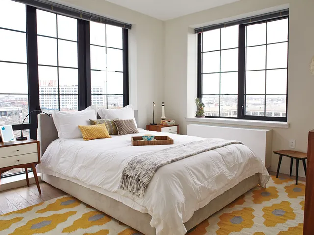 a bathroom with a sink a mirror a bathtub and shower