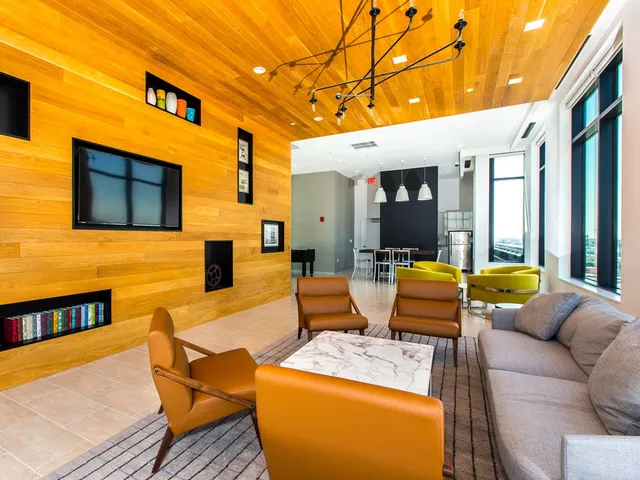 a outdoor living space with furniture and a flat screen tv