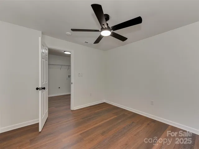 a view of storage and utility room with a window