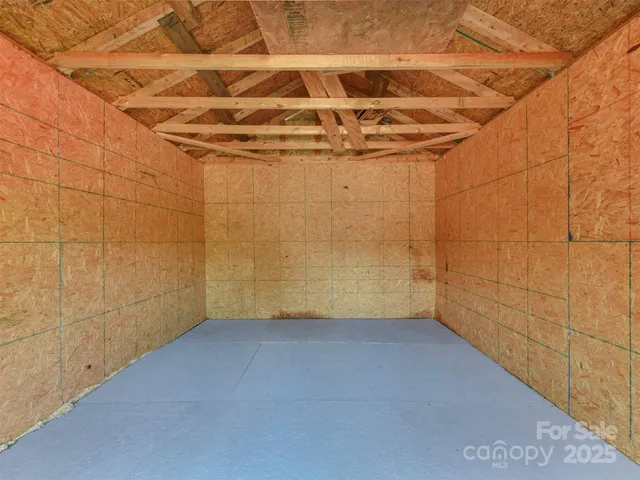 a view of a house with a yard and tree