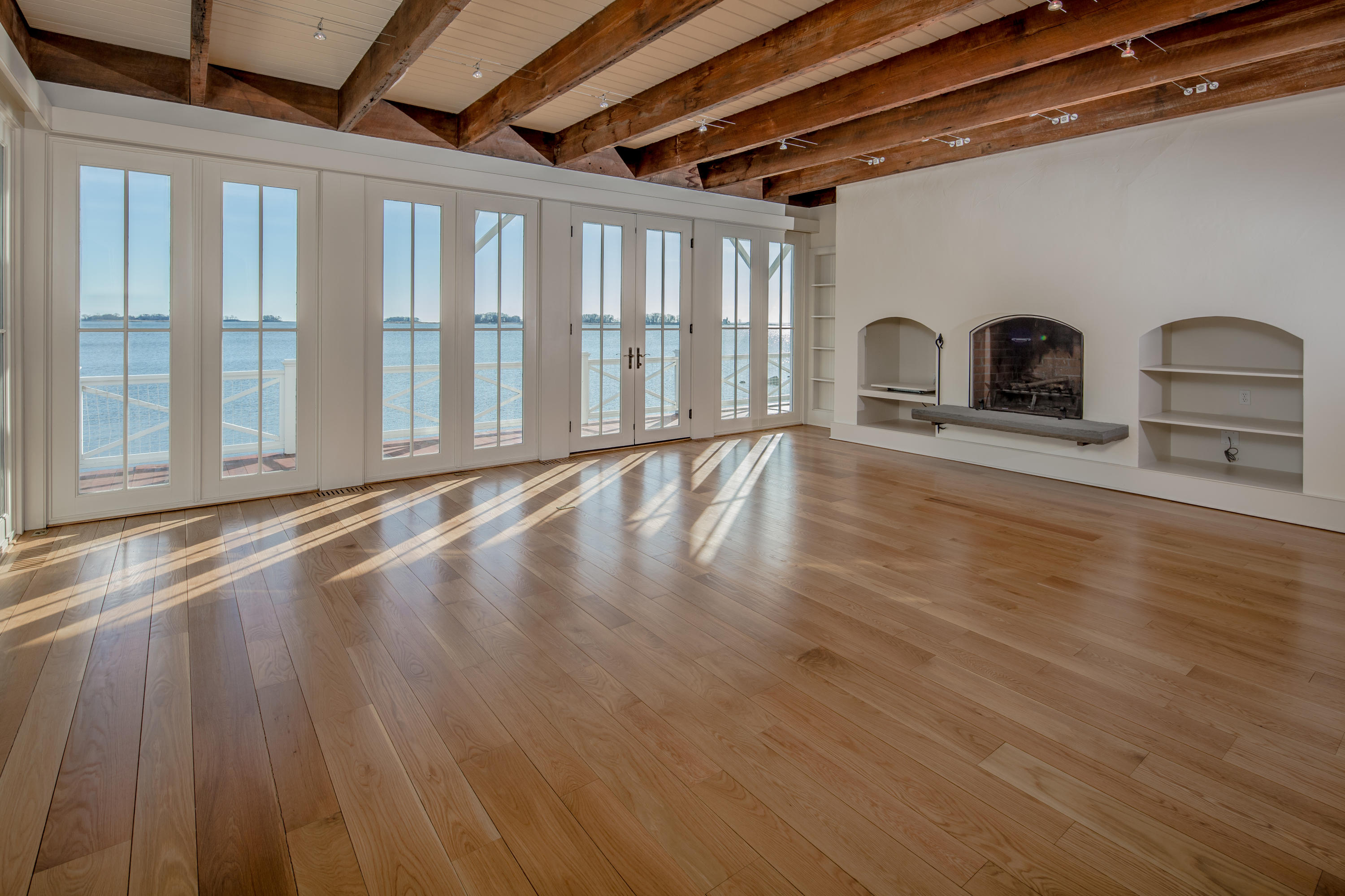 1-2 Rocky Point Road Rowayton, CT 06853 - Photo 13 of 38 a view of empty room with wooden floor