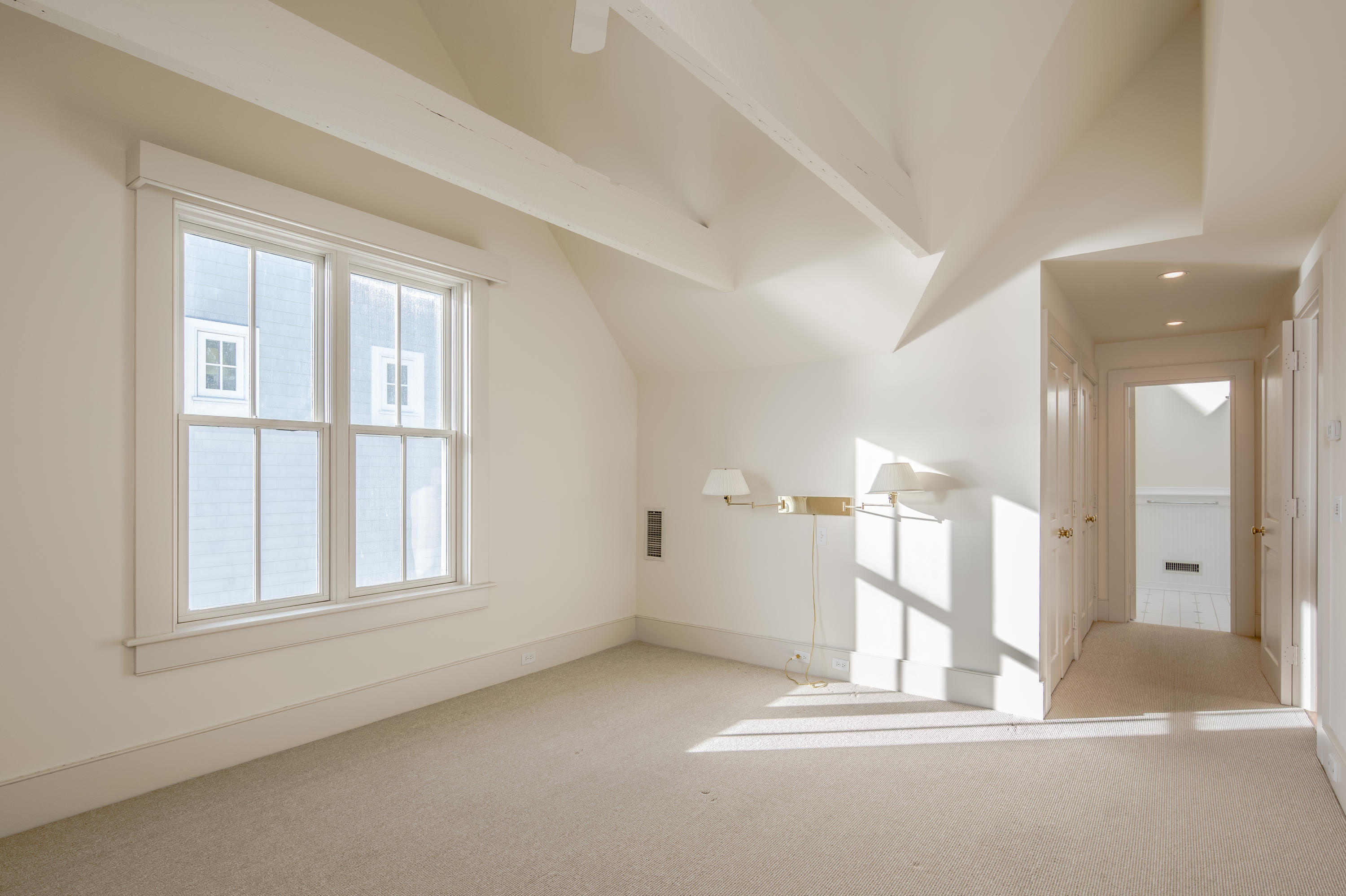 1-2 Rocky Point Road Rowayton, CT 06853 - Photo 33 of 38 a view of empty room with wooden floor and fan