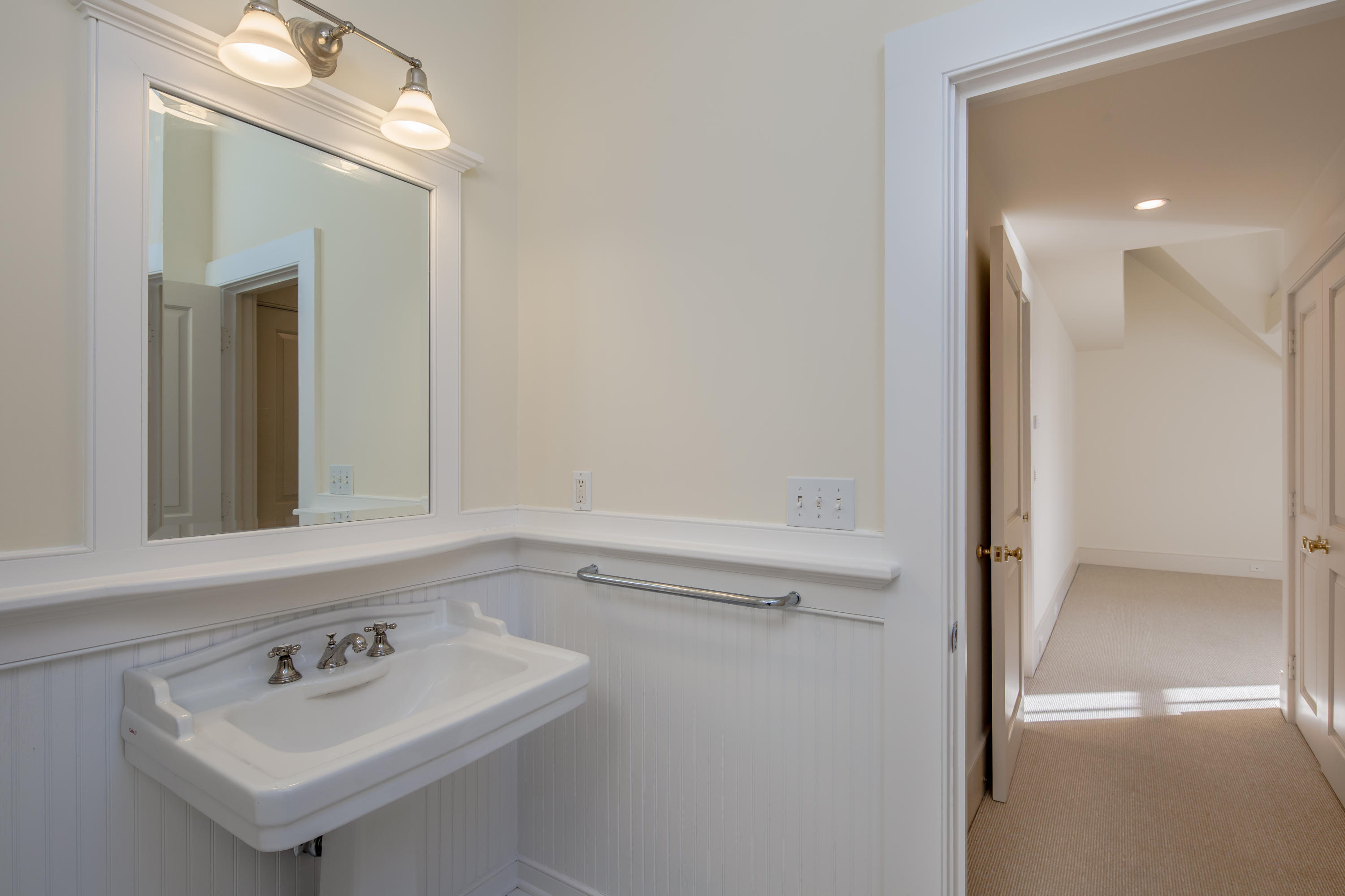1-2 Rocky Point Road Rowayton, CT 06853 - Photo 36 of 38 a bathroom with a sink a vanity and a mirror
