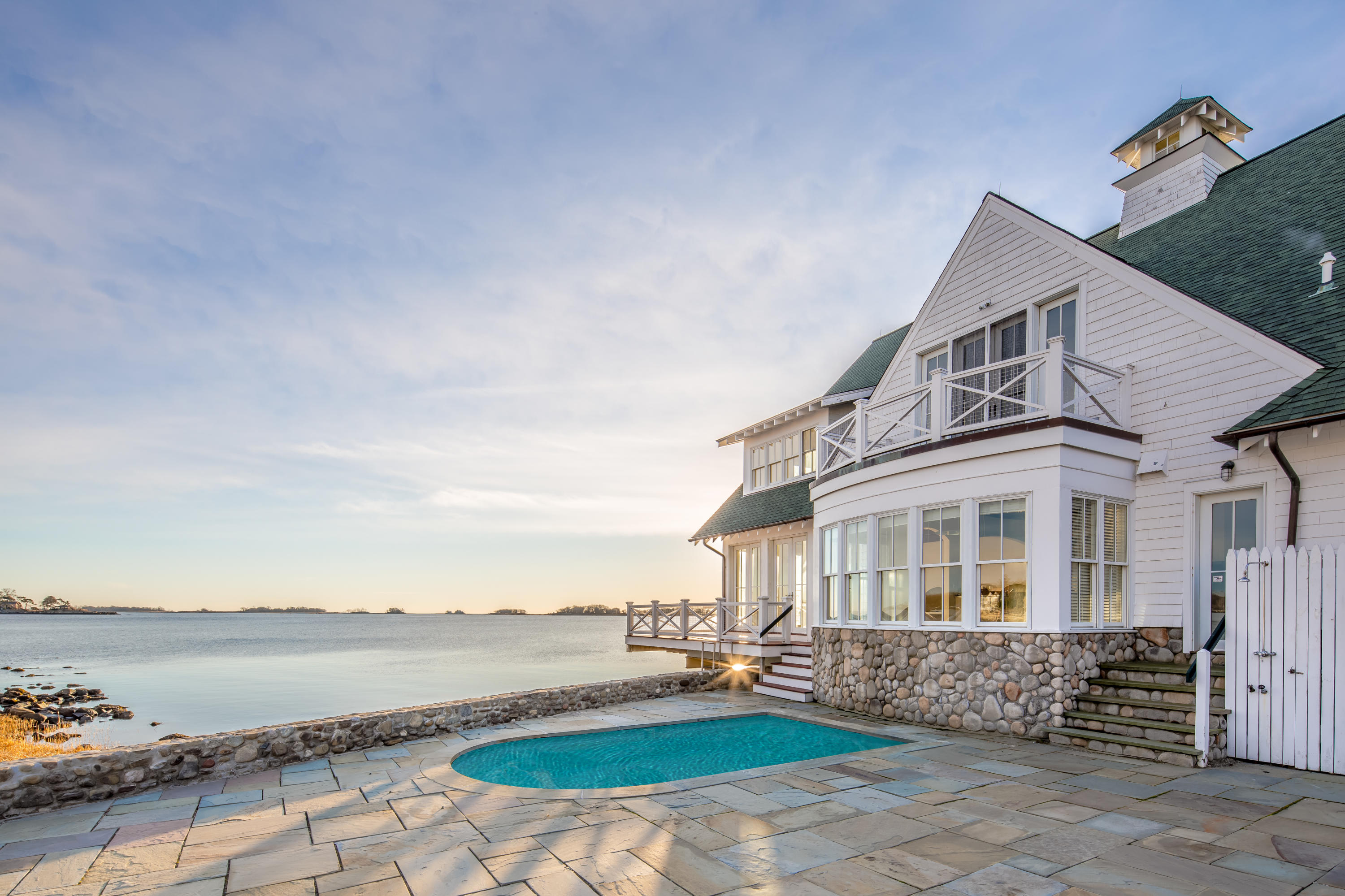 1-2 Rocky Point Road Rowayton, CT 06853 - Photo 8 of 38 a front view of a house with yard and ocean view