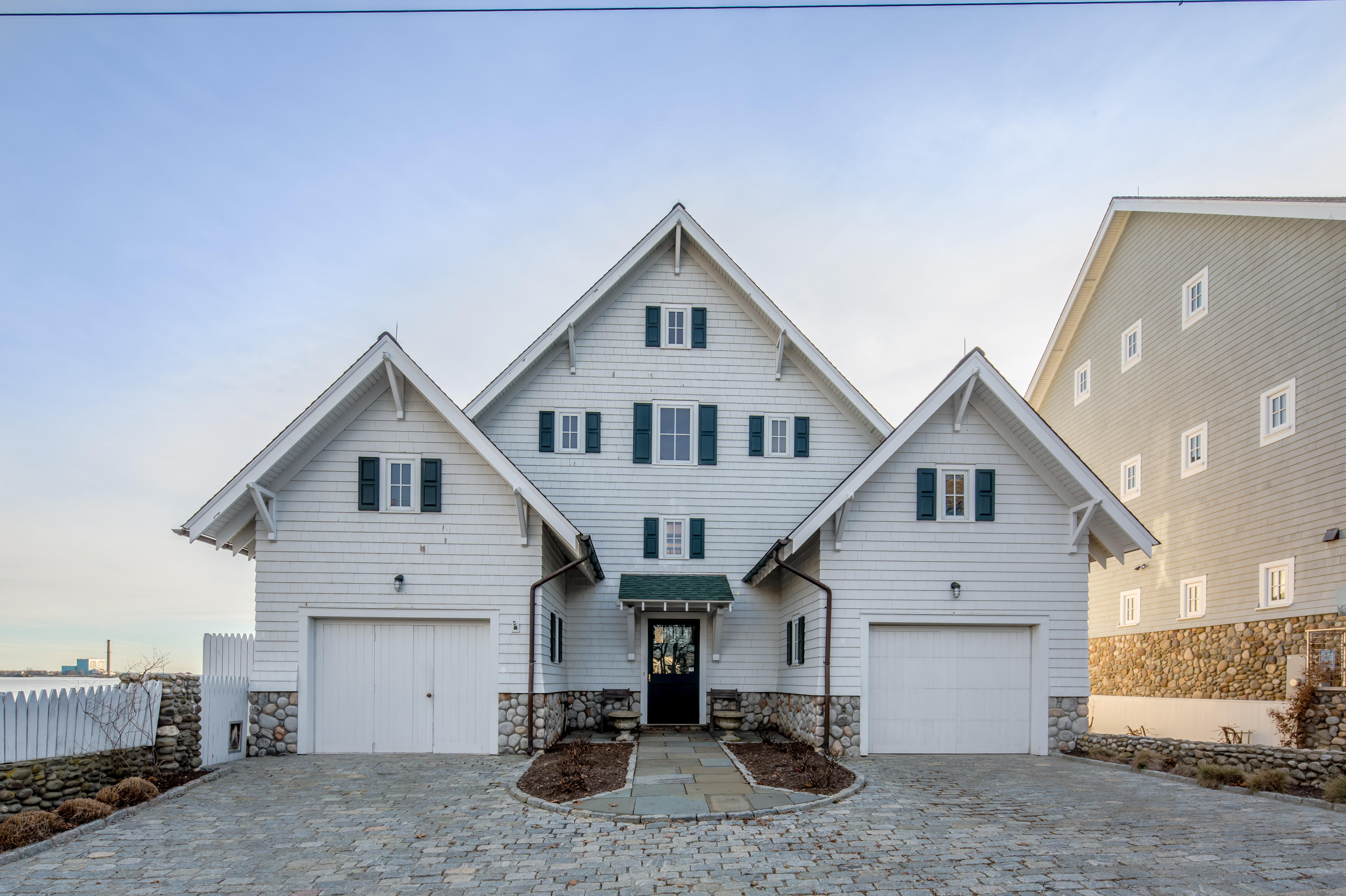 1-2 Rocky Point Road Rowayton, CT 06853 - Photo 9 of 38 a view of a house with garage