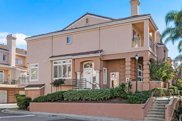 a front view of a building with a yard