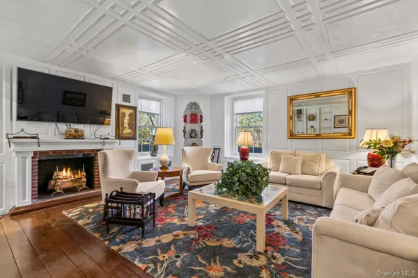 a bedroom with furniture and a chandelier