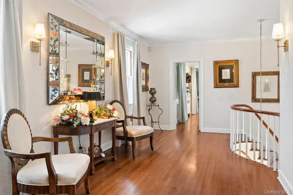 a spacious bathroom with double sink a mirror a vanity and a shower