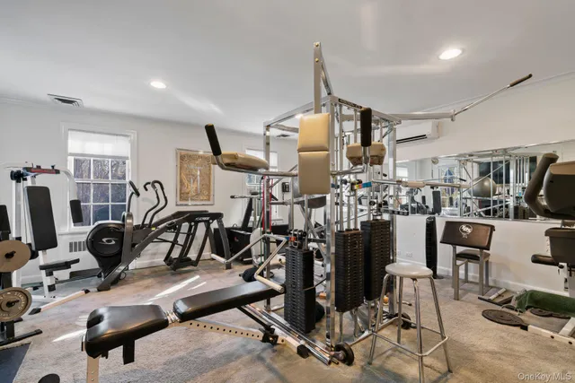 a view of a hallway with wooden floor and glass door