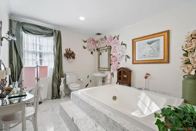 a bedroom with furniture and a rug