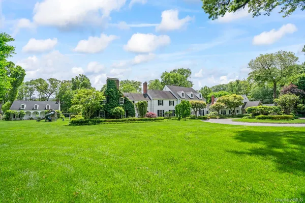 a view of a garden with a building in the background
