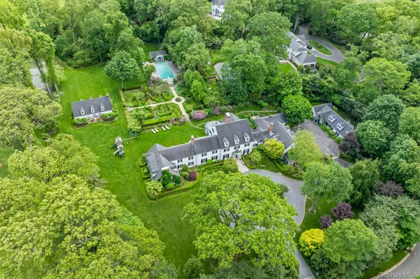 an aerial view of a house with a yard