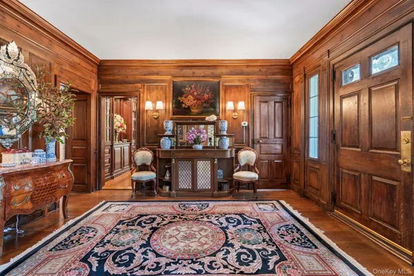 a living room filled with furniture and a rug