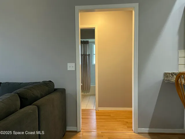 a living room with a couch and a rug