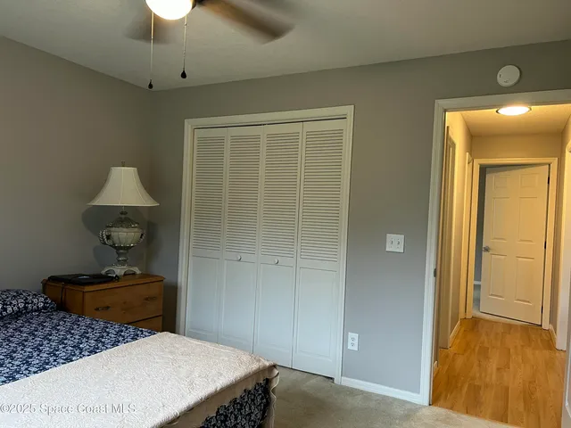 a bedroom with a bed and a table