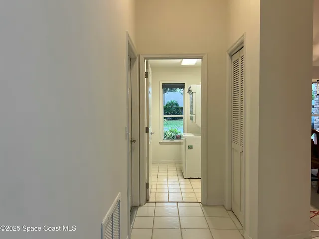 a view of a bathroom from a hallway