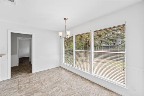 a view of empty room with windows