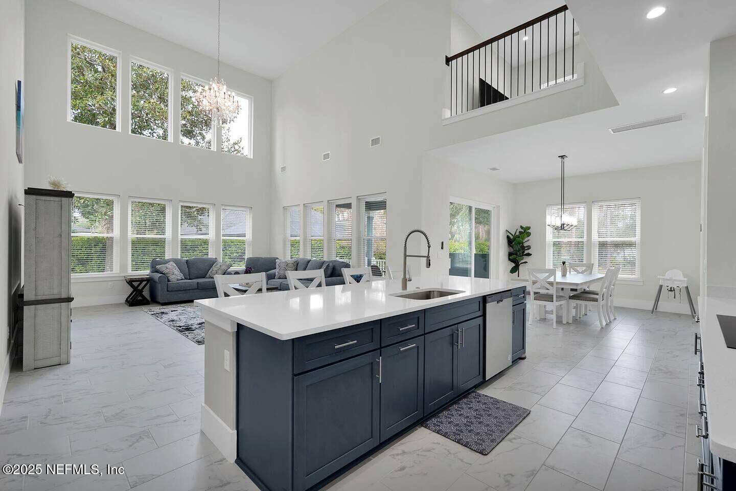 586 A1A North Ponte Vedra Beach, FL 32082 - Photo 11 of 29 a large white kitchen with a large window
