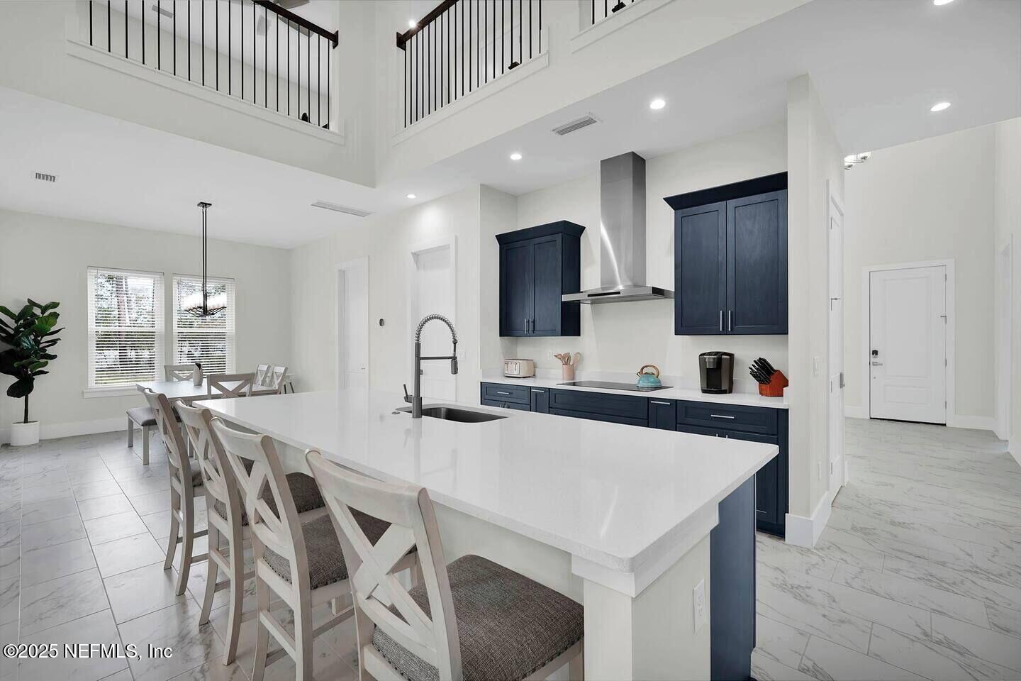 586 A1A North Ponte Vedra Beach, FL 32082 - Photo 13 of 29 an open kitchen with center island and stainless steel appliances