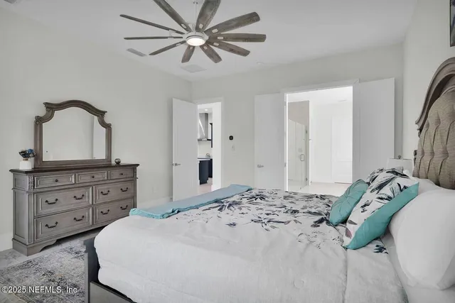 a bedroom with a bed and a dresser