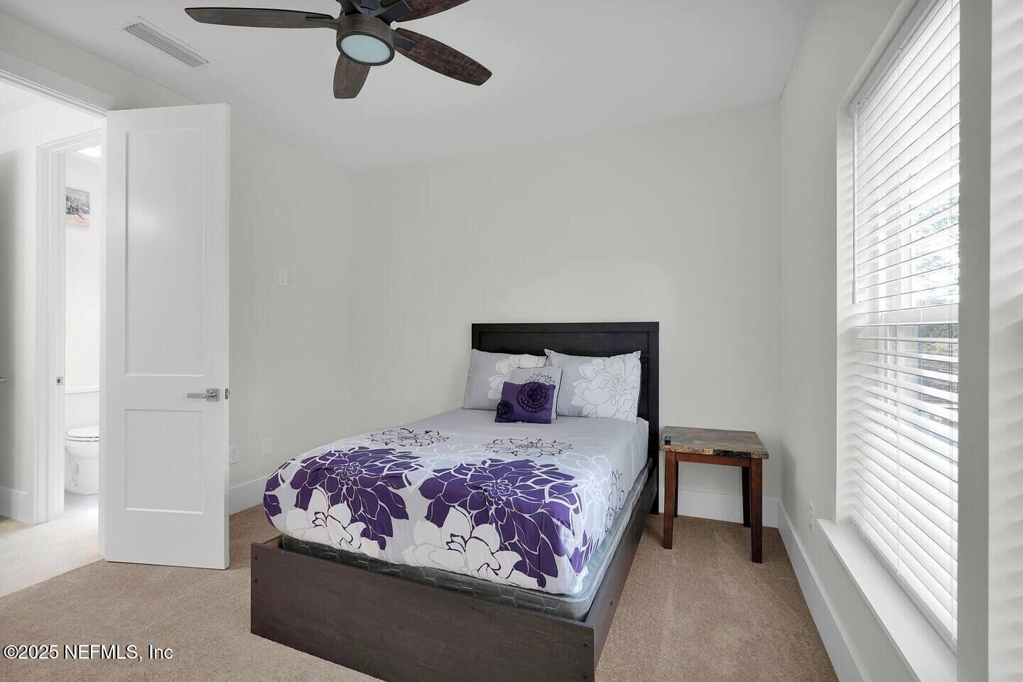 586 A1A North Ponte Vedra Beach, FL 32082 - Photo 25 of 29 a bedroom with a bed and window