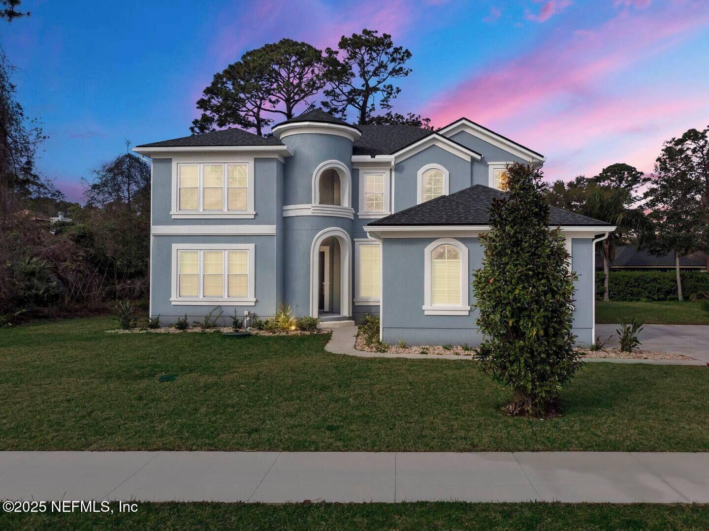 586 A1A North Ponte Vedra Beach, FL 32082 - Photo 29 of 29 a front view of a house with a garden
