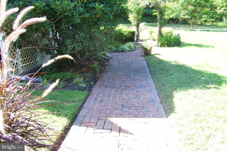 6 Eden Roc Court Baltimore, MD 21208 - Photo 5 of 30 View of brick walkway leading to backyard