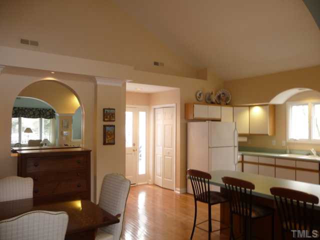 609 Leonidas Court Raleigh, NC 27604 - Photo 5 of 25 The bright kitchen opens to the back porch. Accessible features include special doors and snap-out cabinet fronts that provide roll-under knee space.