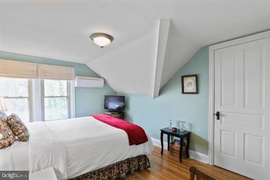 1090 Ragged Edge Road Chambersburg, PA 17202 - Photo 22 of 93 a bed sitting in a bedroom next to a window