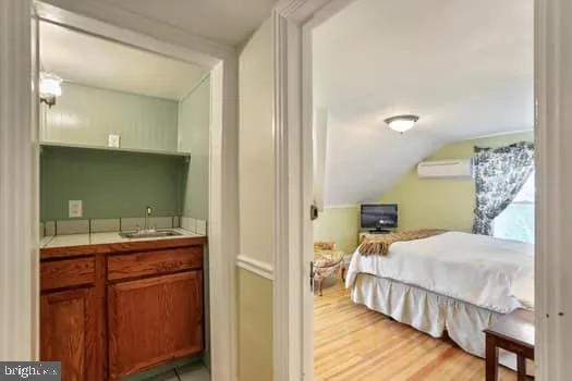 a kitchen with refrigerator cabinets dining table and chairs