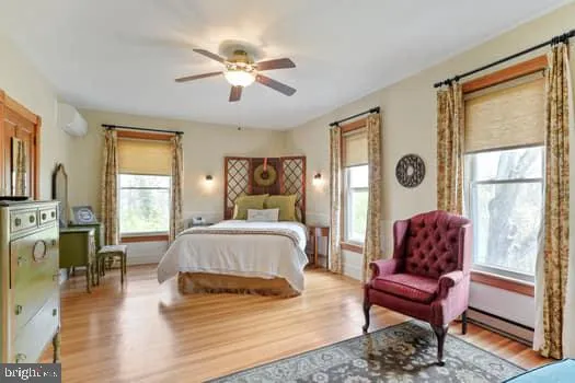 a bed sitting in a bedroom next to a window