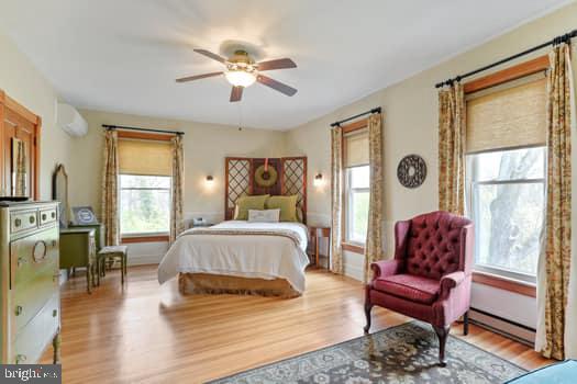 1090 Ragged Edge Road Chambersburg, PA 17202 - Photo 45 of 93 a bedroom with a bed and wooden floor