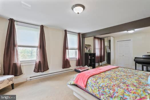 1090 Ragged Edge Road Chambersburg, PA 17202 - Photo 80 of 93 a bed sitting in a bedroom next to a window