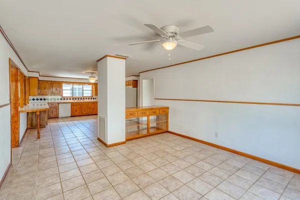 a large kitchen with cabinets and stainless steel appliances