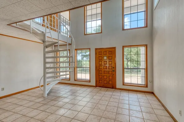 a view of an empty room and window