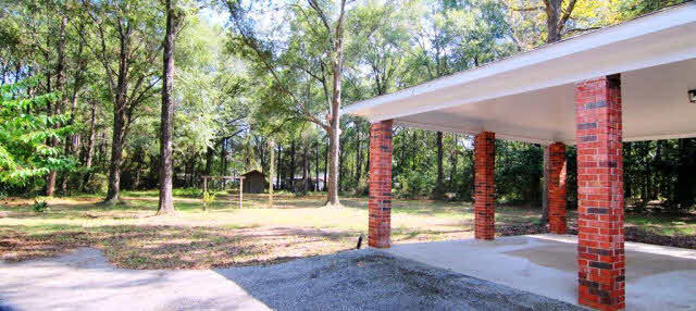 3384 Lacoste Road Mobile, AL 36618 - Photo 19 of 21 Carport behind house