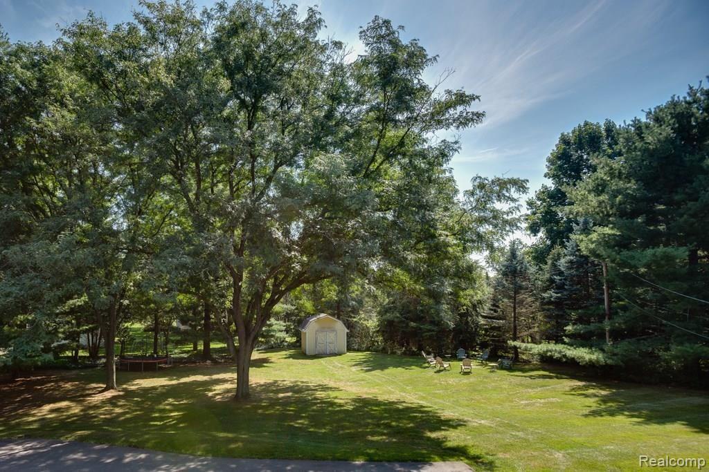 668 Burns Road Milford, MI 48381 - Photo 5 of 24 Huge backyard with shed for your toys.