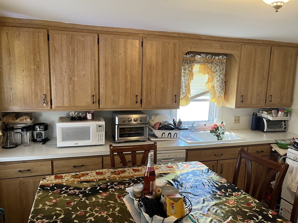 115 Denwall Drive Springfield, MA 01119 - Photo 8 of 12 a kitchen with sink a stove and cabinets