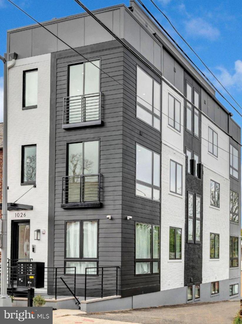 1026 18th Street Northeast, Unit PH7 Washington, DC 20002 - Photo 19 of 21 a front view of a building with street