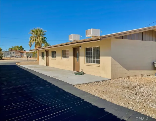 a front view of a house with beach