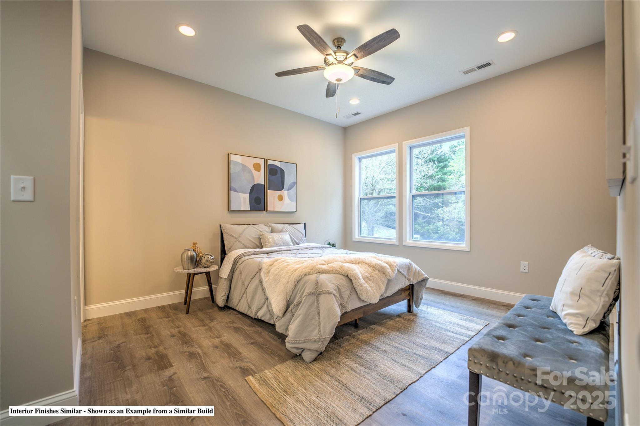 396 Deaverview Road Asheville, NC 28806 - Photo 20 of 35 a spacious bedroom with a bed and a window
