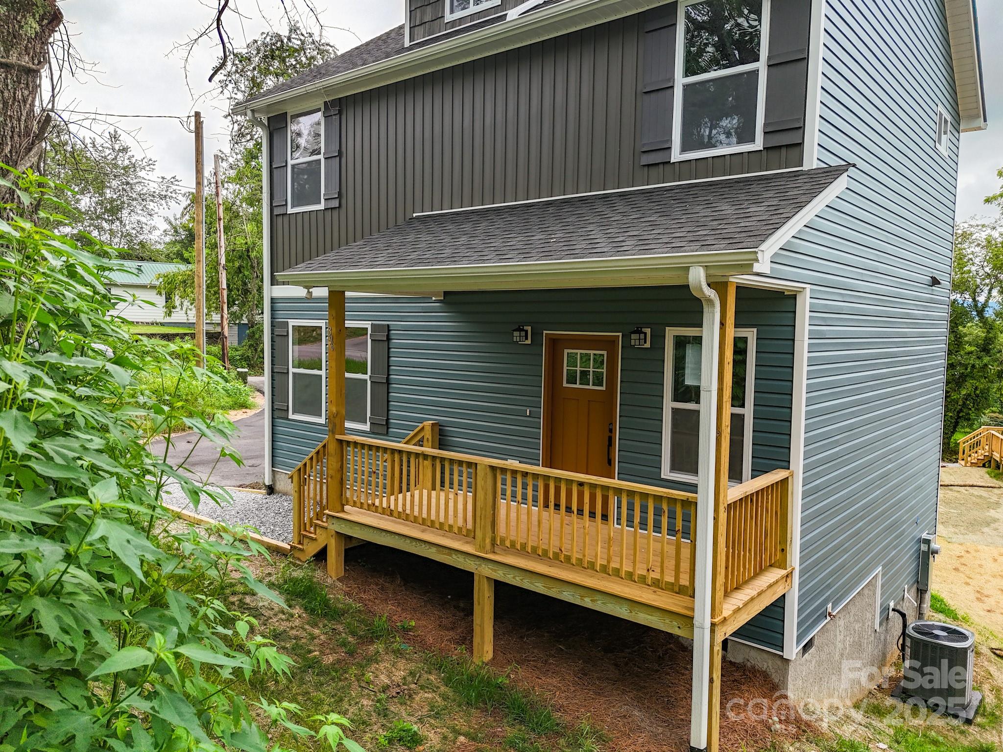 396 Deaverview Road Asheville, NC 28806 - Photo 2 of 35 a view of a house with a wooden deck