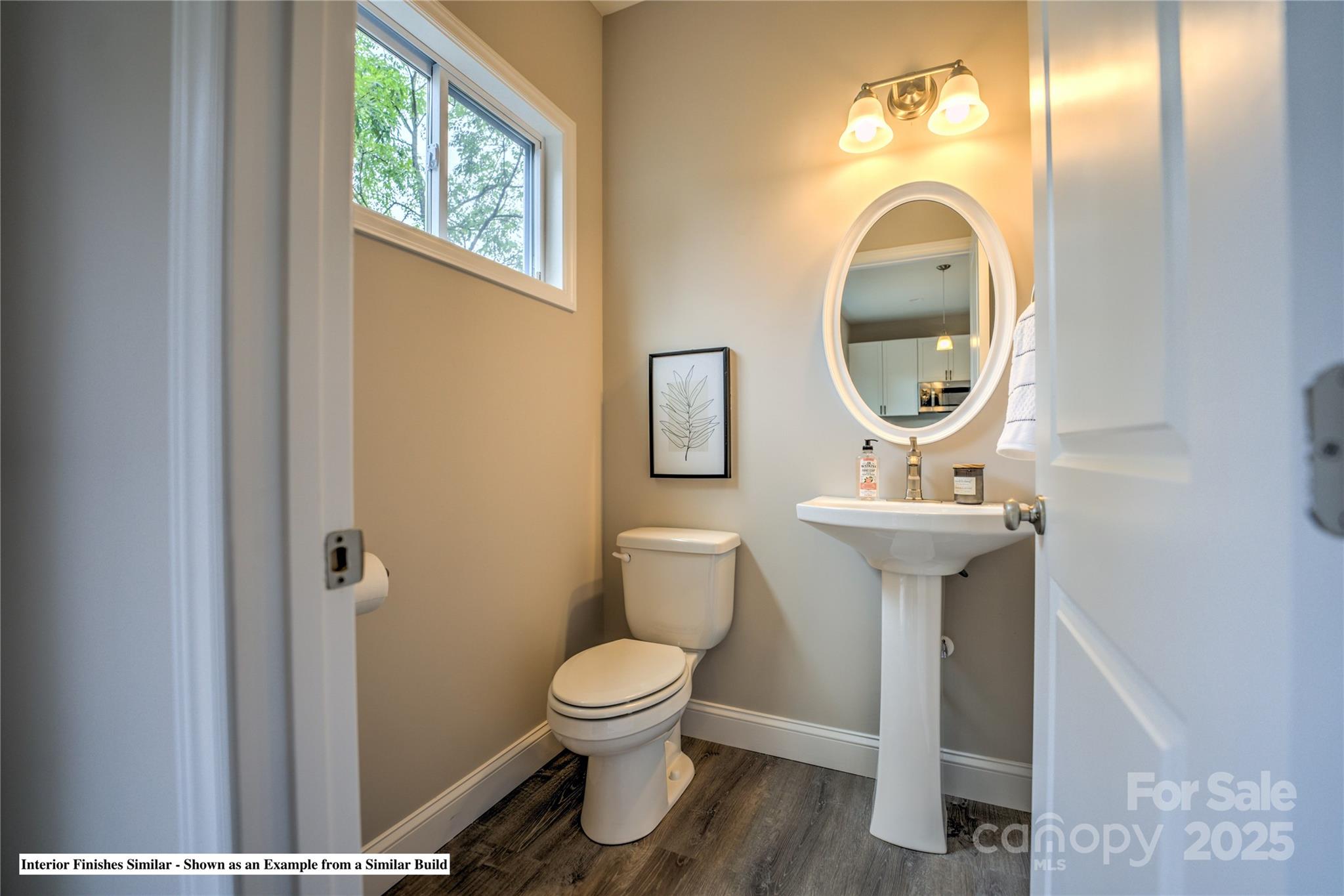 396 Deaverview Road Asheville, NC 28806 - Photo 24 of 35 a bathroom with a toilet sink and mirror
