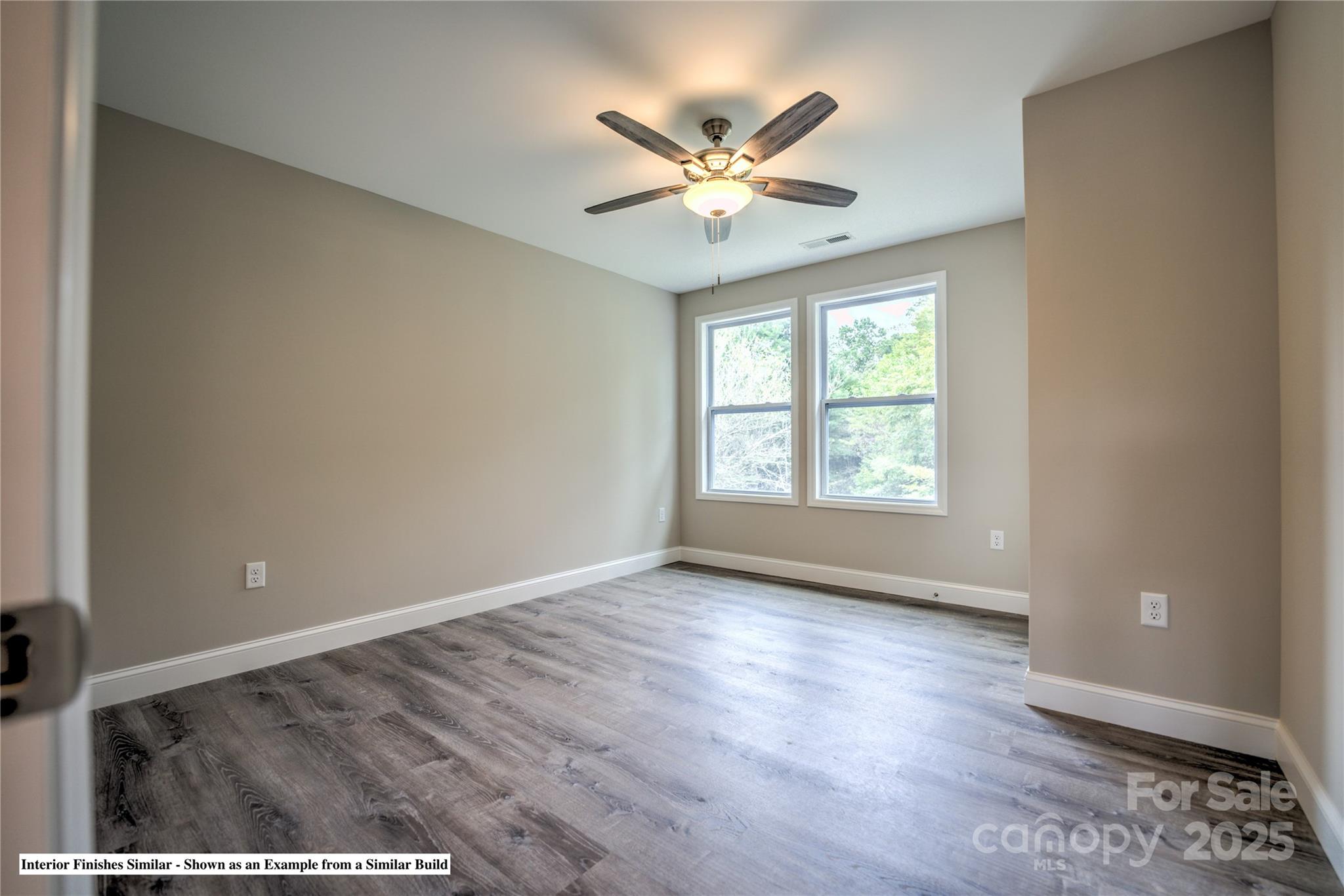 396 Deaverview Road Asheville, NC 28806 - Photo 29 of 35 a view of an empty room with wooden floor and a window
