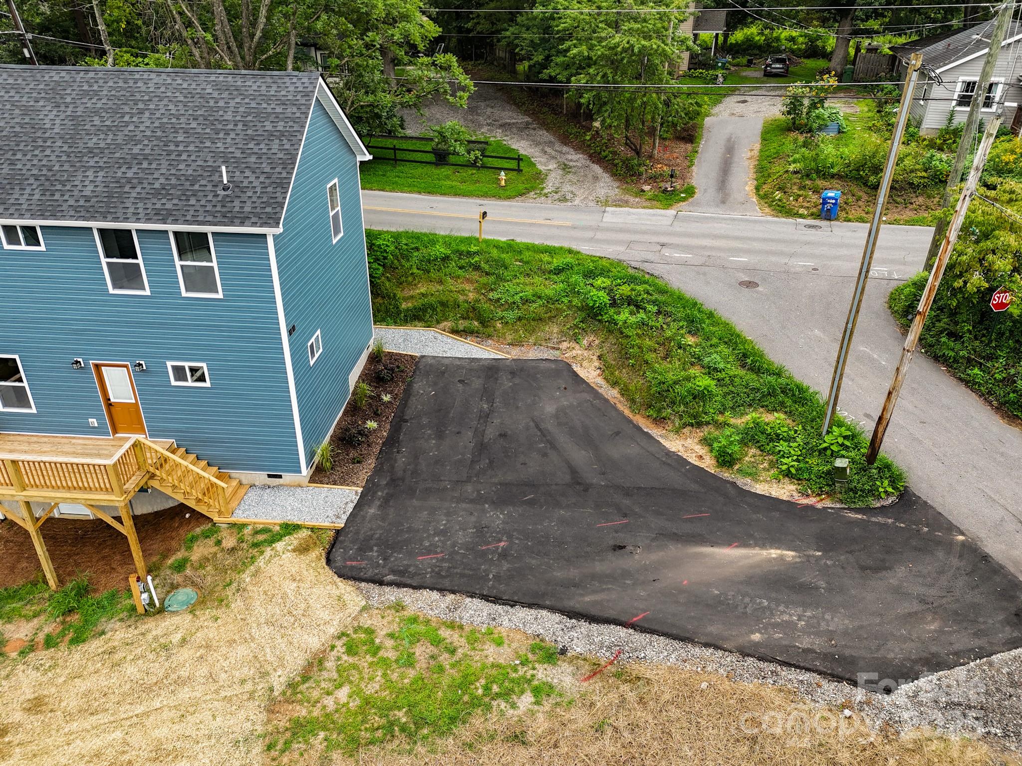 396 Deaverview Road Asheville, NC 28806 - Photo 4 of 35 an aerial view of a house with a yard and potted plants