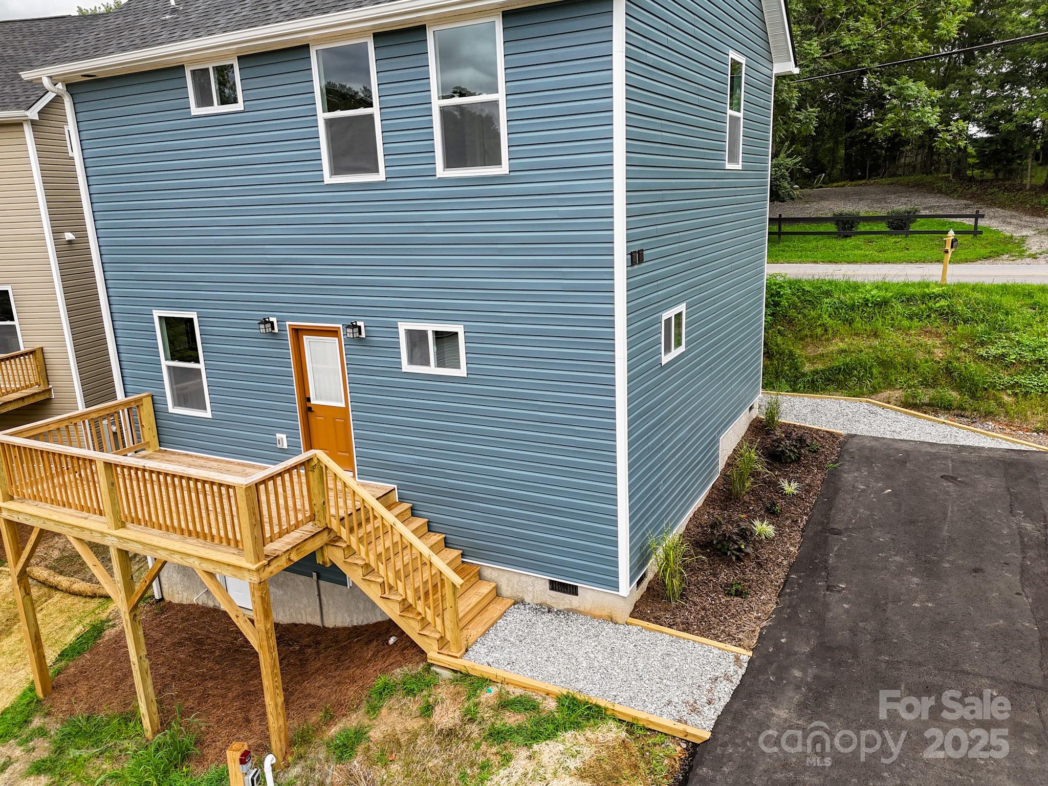 396 Deaverview Road Asheville, NC 28806 - Photo 6 of 35 a view of a house with backyard and a chair