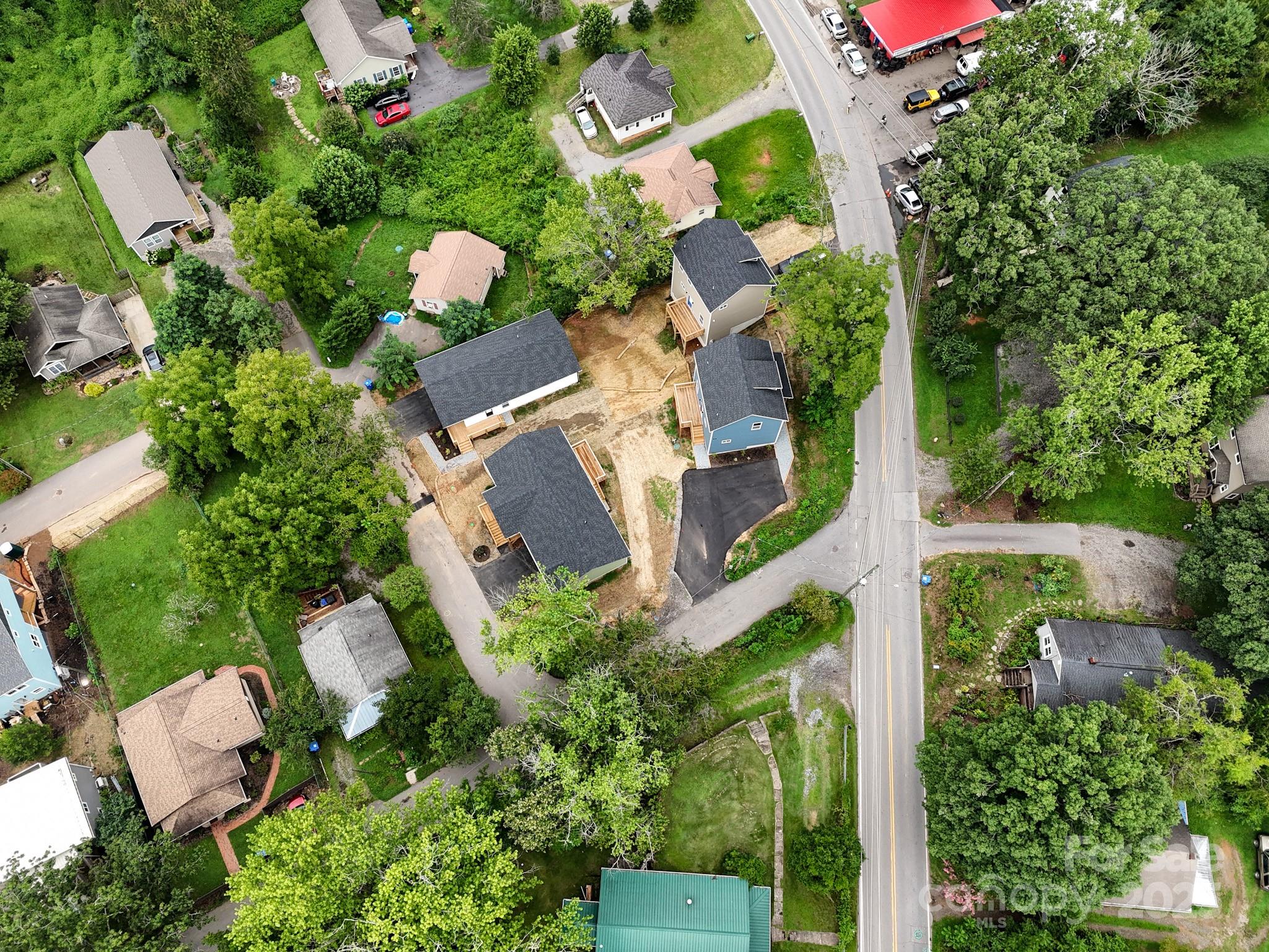 396 Deaverview Road Asheville, NC 28806 - Photo 8 of 35 an aerial view of a house with a yard and outdoor seating