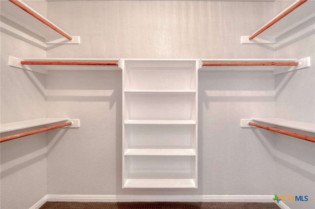 513 South Mockingbird Lane Lockhart, TX 78644 - Photo 18 of 25 a view of an empty walk in closet
